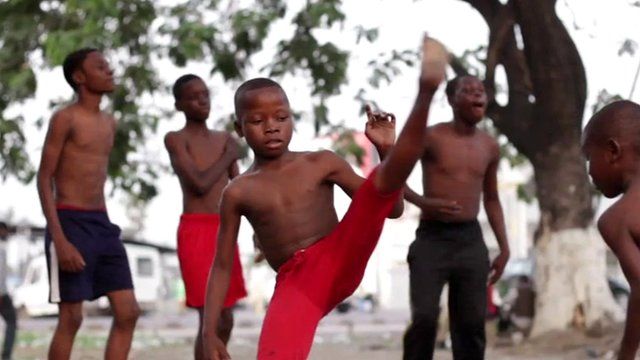 A child dancing at a capoeira class