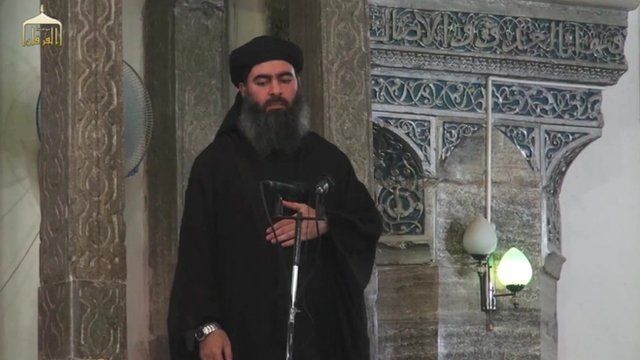 Still from Isis video of Abu Bakr al-Baghdadi in a mosque