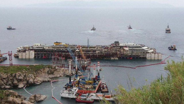 Costa Concordia surrounded by ships