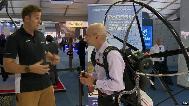 Tom Prideaux-Brune (on the left) and the BBC's Theo Leggett kitted out in a paramotor