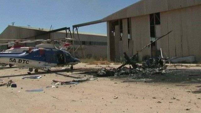 Burnt out helicopters at Tripoli airport