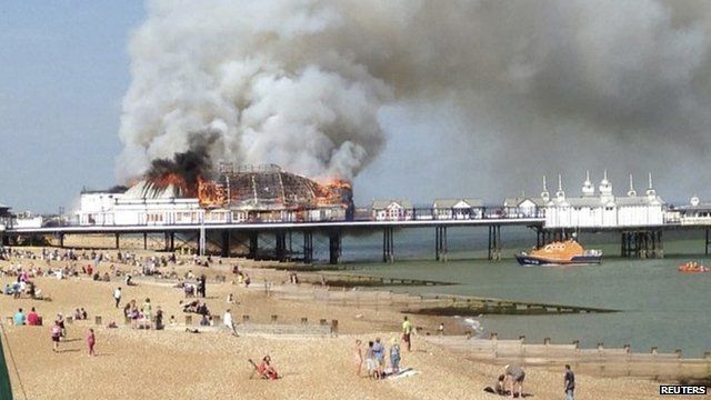 Fire and smoke engulf the pier