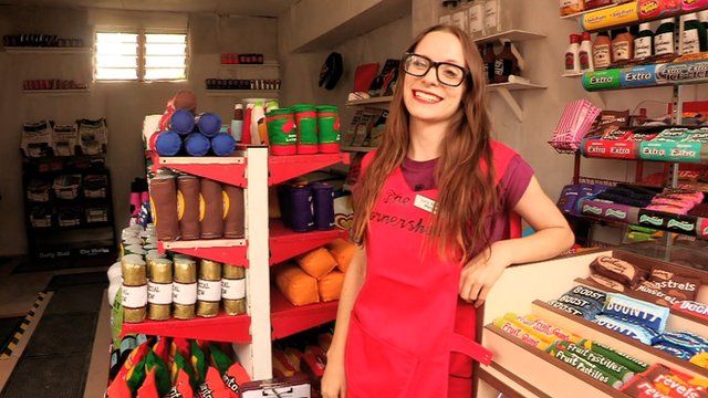 Lucy Sparrow in her corner shop selling felt goods