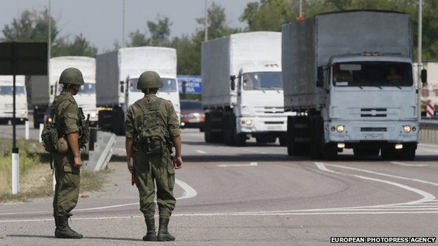 Military personnel and Russian humanitarian convoy.