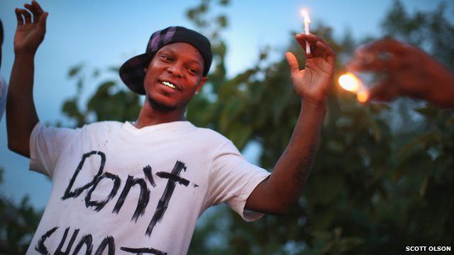 Demonstrators gather to protest the shooting death of Michael Brown