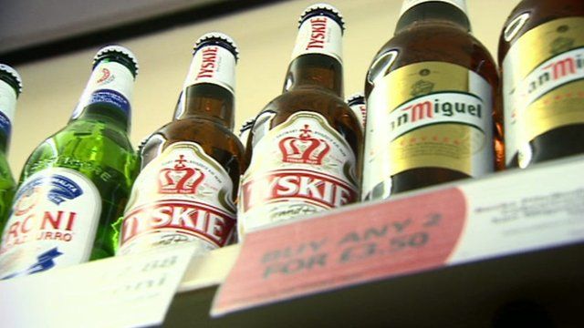 Bottles of alcohol on shelves in a shop