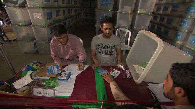 Vote-checkers seated around table