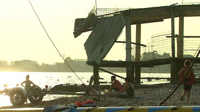 Collapsed Soviet architecture litter the seafront