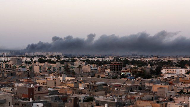 Smoke fills the sky over Tripoli