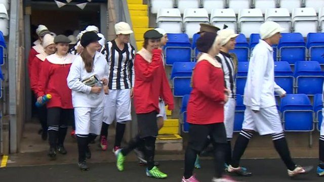 Coventry City Ladies Football Club members walk on to the pitch