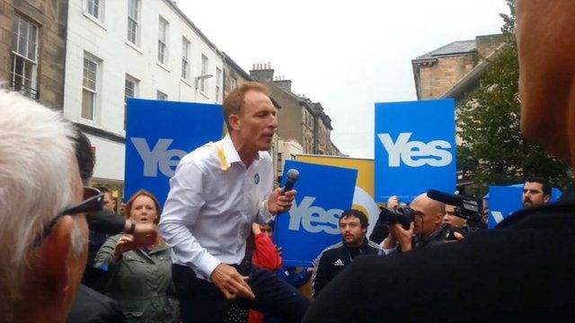 Jim Murphy is hit by an egg