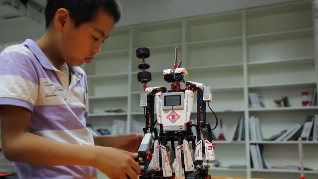 Boy building robot