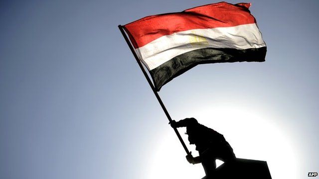 Man waving Egyptian flag