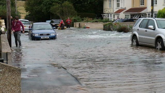 Water floods road