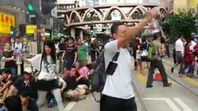 Protesters spraying water