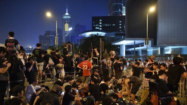 Demonstrators gather in front of embattled leader CY Leung"s office in Hong Kong