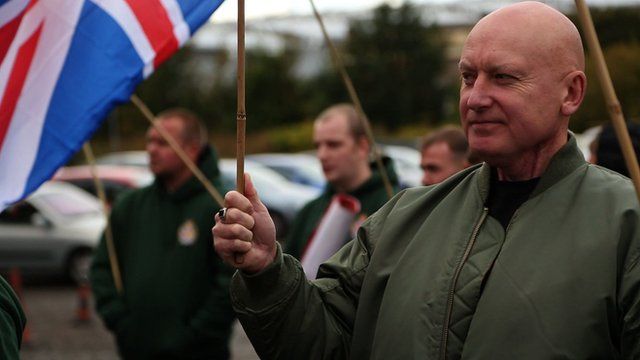 Britain First supporter holding union jack