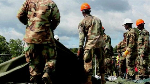 Workers in Liberia erect a treatment centre
