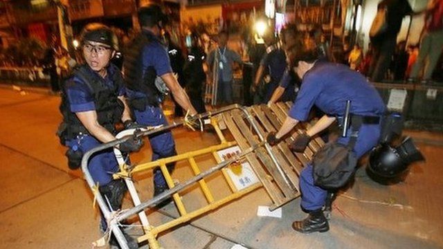 Riot police remove barricades at the pro-democracy camp in Mong Kok - 17 October 2014