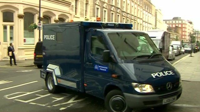Police van bringing suspects to court