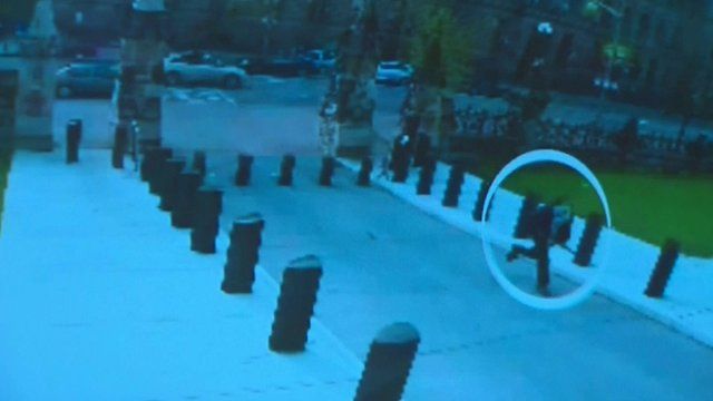 The suspect running towards the parliament building