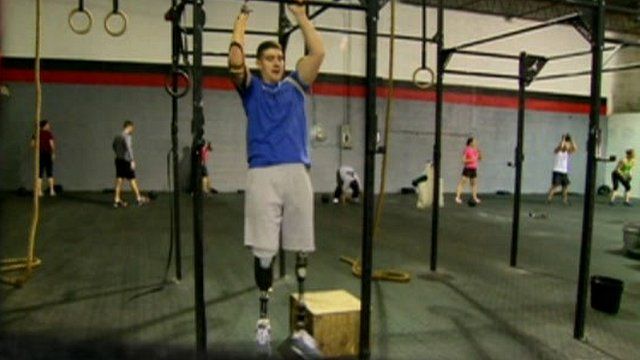 Man with prosthetic limbs doing exercises