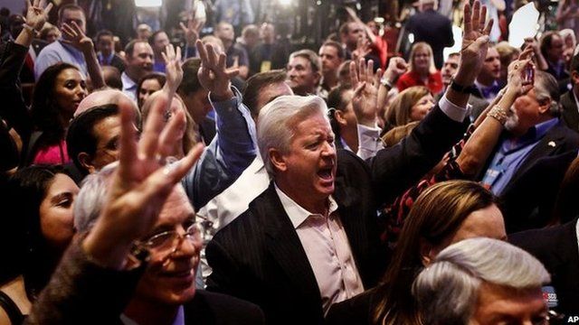 Daryl Johnson, centre, screams, "Four more years," for Gov. Rick Scott along with the crowd of supporters as they watch the election results at the Hyatt Regency Coconut Point in Bonita Springs