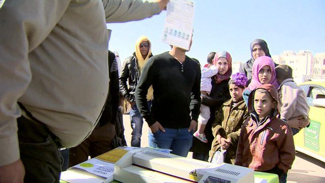 Syrian refugees at a border crossing