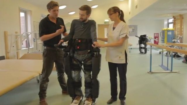 Gareth Herridge walks with help from the robotic skeleton