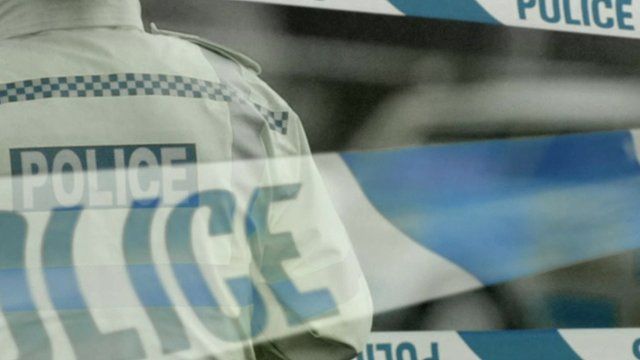 Image of policeman and tape