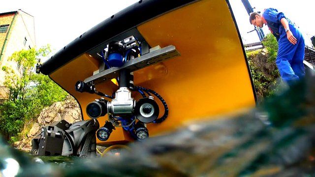 Robot being lowered into the water