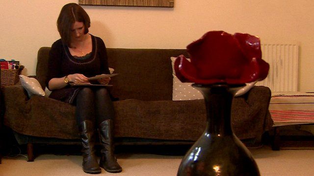 An owner of a tower poppy displays it in a vase