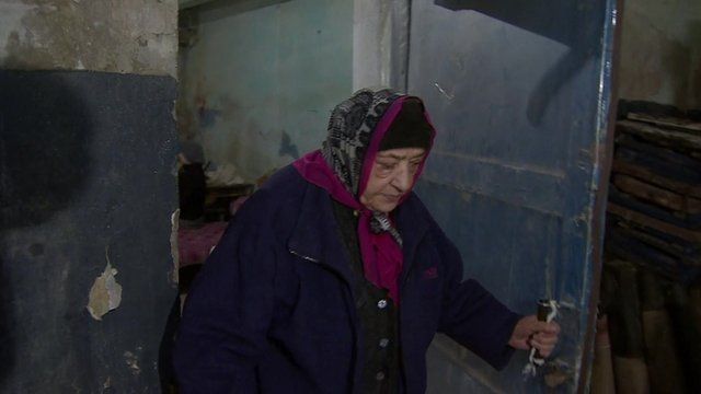 An old woman in a shelter in east Ukraine