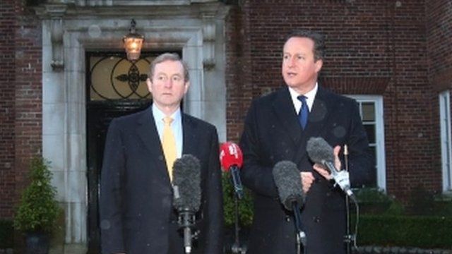 The British Prime Minister, David Cameron, right, and Irish Prime Minister, Enda Kenny, speak to the media at Stormont