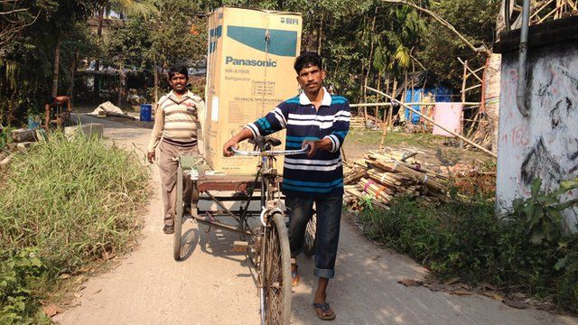 Fridge carried on a bicycle