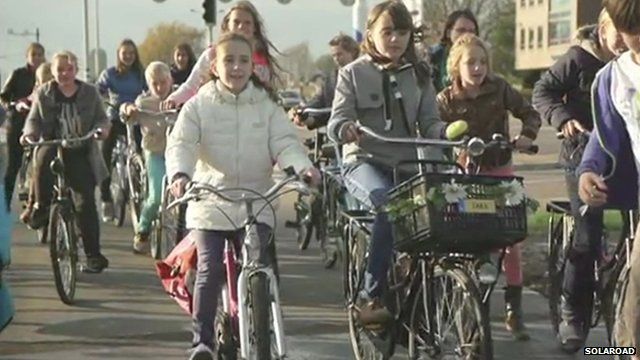 Cyclists on a solar road