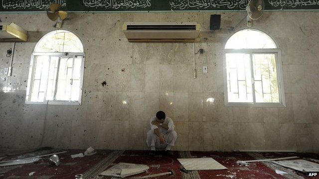 Man against wall of mosque following attack