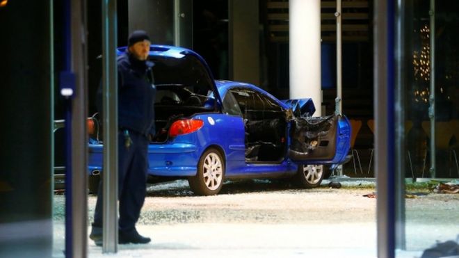 A damaged car is pictured inside the party headquarters of the Social Democratic Party of Germany (SPD) after it crashed into the building in Berlin, Germany, at midnight on 25 December, 2017.