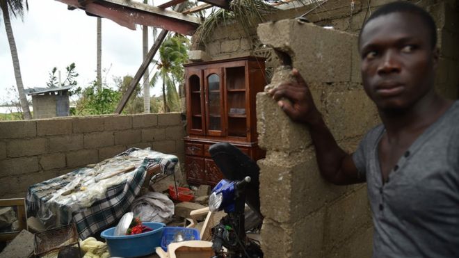 Stanley stands in his destroyed house after the passing of Hurricane Matthew, in Les Cayes, in Southwest Haiti
