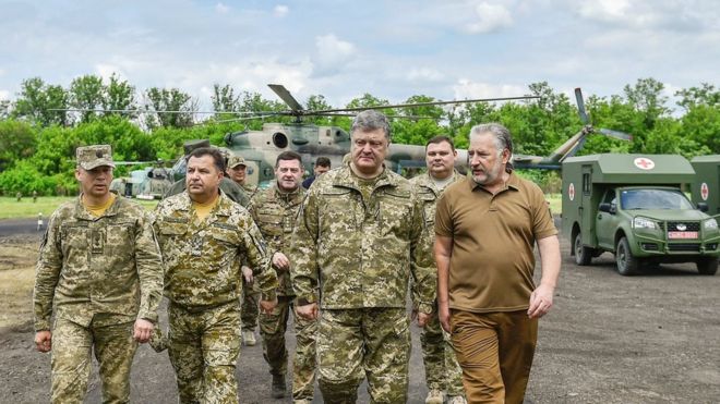 Ukrainian President Petro Poroshenko meets servicemen during a visit to Donetsk region in June