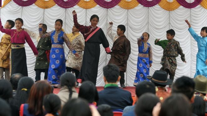 Young exiled Tibetans dance during celebrations marking the Lunar New Year or Sonam Lhosar in Kathmandu on February 16, 2018