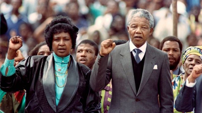 Winnie and Nelson Manela with their fists raised at Soweto Soccer Stadium in 1990