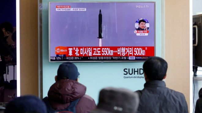 Passengers in Seoul watch TV report of N Korean missile launch