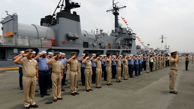 Filipino Navy officers and personnel salute as navy ship BRP Andres Bonifacio FF17 docked at a port in Manila, Philippines, 06 April 2017.