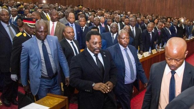 Congolese President Joseph Kabila (centre) arrives to deliver a speech to the nation in front of the upper and the lower chambers at the Palace of the People (Palais du Peuple) in Kinshasa (05 April 2017)