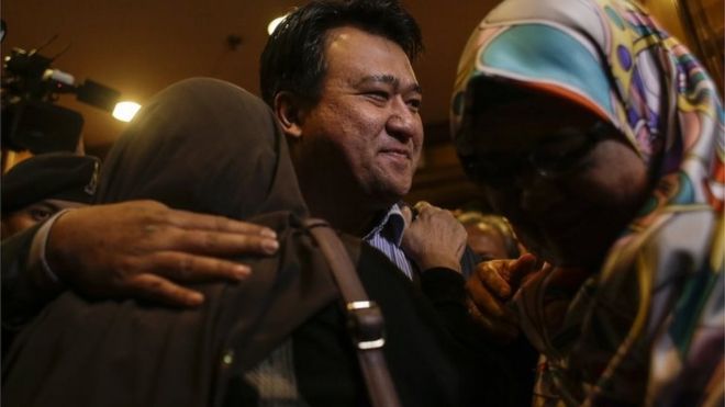 Mohd Nur Azrin Md Zin (C), one of the nine returning Malaysian nationals hugs his family members upon arriving at the Bunga Raya complex, Kuala Lumpur International airport in Sepang, Malaysia, 31 March 2017
