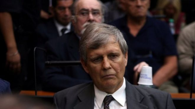 Former Argentine navy officer Afredo Astiz and other members of Argentina's Naval Mechanics School, known as the ESMA, where the military regime held and tortured thousands of leftists from 1976 to 1983, attend the sentence hearing of the five-year trial for their role during the 1976-1983 dictatorship in Buenos Aires,