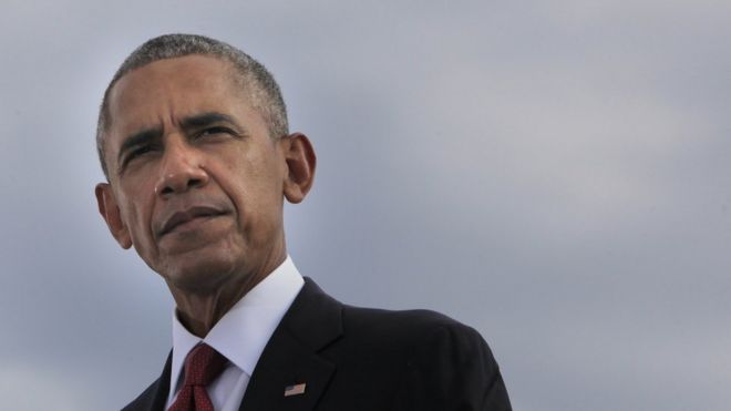 President Barack Obama participates in a moment of silence during a ceremony to mark the 15th anniversary of the 9/11 terrorists attacks at the Pentagon Memorial.