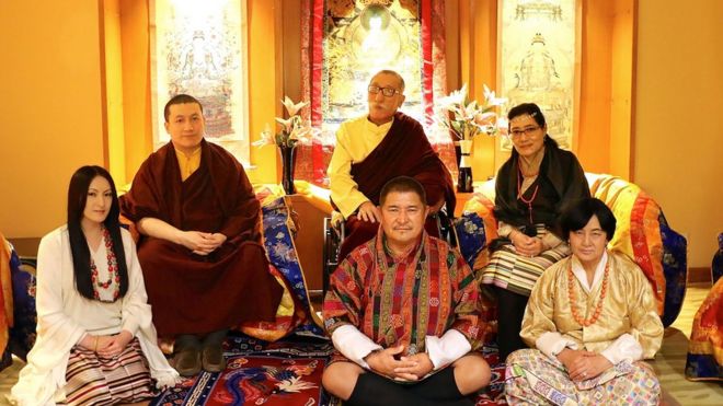 , shows The Karmapa Thaye Dorje (2L) and his parents Mipham Rinpoche (C/TOP), Dechen Wangmo Bottom (R/REAR) Rinchen Yangzom (L) and her parents Chencho (C/FRONT) and Kunzang (R) as they pose in New Delhi on March 25, 2017