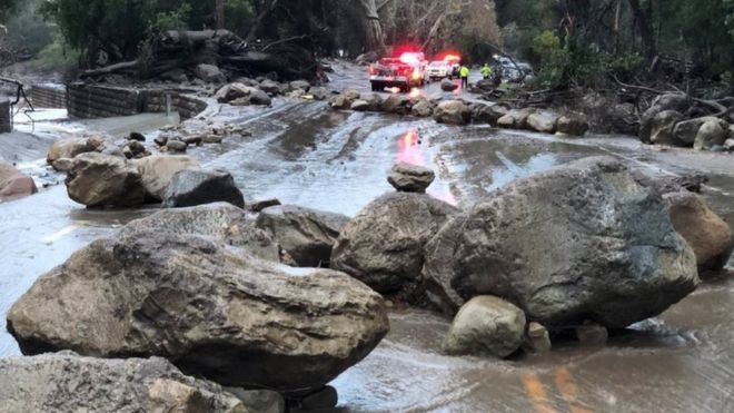 Boulders block a road after a mudslide in Montecito, California.